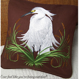 Snowy Egret on Rich Chocolate Pillow